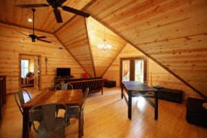 cabin loft with ping pong table, futon, dining table