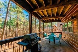 Where Else cabin deck with gas grill, table and chairs