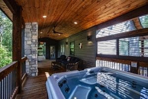 Broken Bow Cabins Texas Time hot tub on patio deck