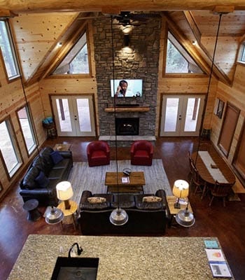 loft view of Mended Bow living room and fireplace.